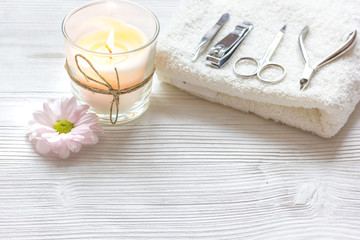 Fototapeta na wymiar spa nail care with aroma candle on wooden background