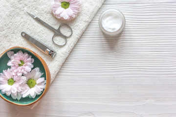 Obraz na płótnie Canvas oil and cream for nail care in spa top view