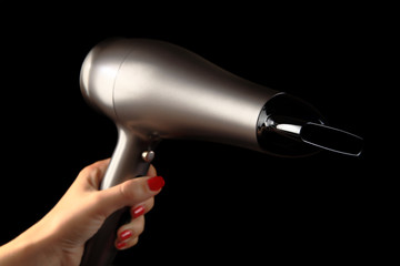 Hair dryer in  female hand