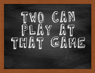 TWO CAN PLAY AT THAT GAME handwritten text on black chalkboard