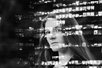 Obraz premium Portrait of girl on the background of office windows . Concept of business, new opportunities, partnership. Double exposure