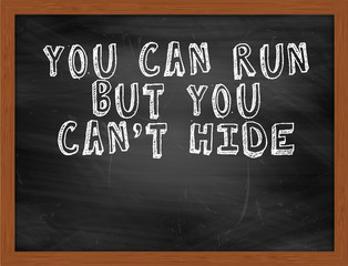 YOU CAN RUN BUT YOU CANT HIDE handwritten text on black chalkboa