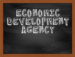 ECONOMIC DEVELOPMENT AGENCY handwritten text on black chalkboard