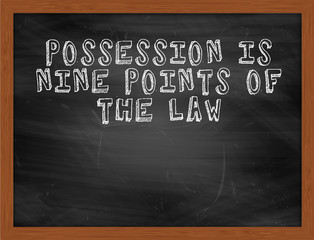 POSSESSION IS NINE POINTS OF THE LAW handwritten text on black c