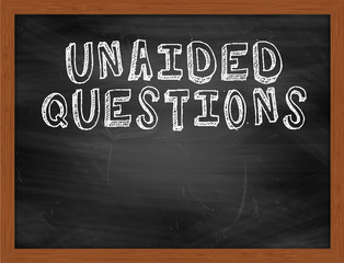 UNAIDED QUESTIONS handwritten text on black chalkboard