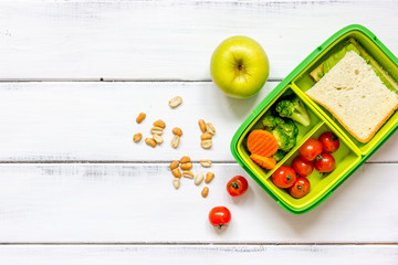 preparing lunch for child school top view on wooden background