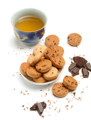 Cup of green chinese tea, tasty biscuit cookies and dark chocola