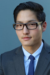 Smiling Asian businessman with glasses