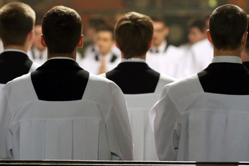 The young clerics of the seminary during Mass - 126469826