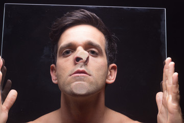 young man head face pressed against glass