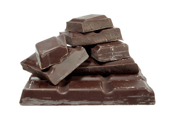 Pieces of dark chocolate isolated on white background
