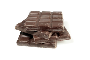 Pieces of dark chocolate isolated on white background
