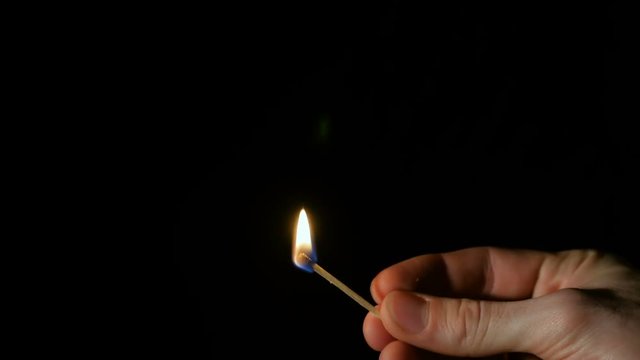 Burning Match in Hand