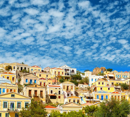 Fototapeta na wymiar Greece. Dodecanesse. Island Symi Simi . Colorful houses on the rocks