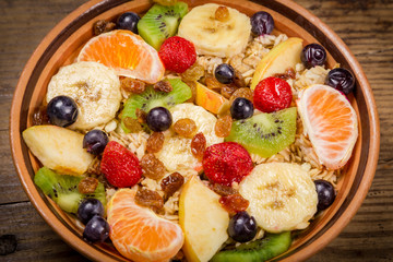 Closeup of oatmeal with fruits in bowl