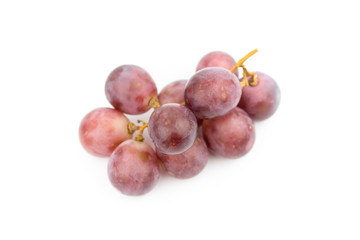 Ripe red grape with leaves isolated on white