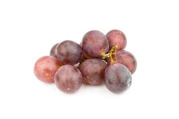 Ripe red grape with leaves isolated on white