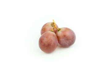 Ripe red grape with leaves isolated on white