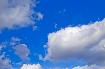 White clouds in a deep blue sky
