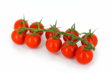 Bunch of fresh red tomatoes isolated on white background