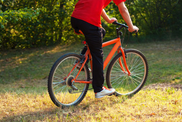Fototapeta na wymiar Young athlete man cycling outdoor
