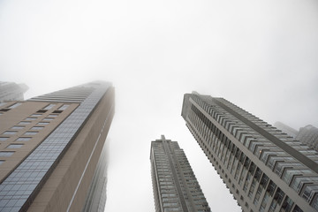 Renoir Towers. Downtown skyscrapers under the fog upward view at the Puerto Madero.