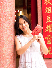  lady holding red envelope or Ang-pow .