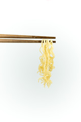chopsticks noodles isolated on white background