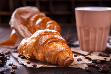  Christmas or New Year pastries,Croissant with a warming drink,coffee.Winter Holidays Concept.Holiday Decorations. top view.Vintage style. selective focus.