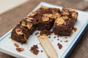 Delicious cake chocolate walnut brownies on wooden desk