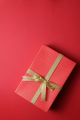 Simgle present on plain red background