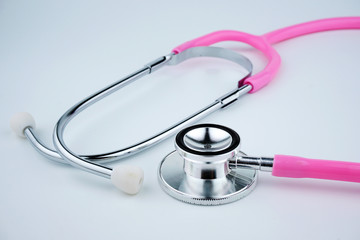 Pink Stethoscope On White Background. Healthcare Concept.