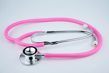Pink Stethoscope On White Background. Healthcare Concept.