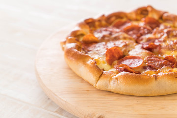 Homemade Pepperoni Pizza on wood plate