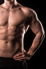 Fototapeta na wymiar half body of muscular bodybuilder man, upper body , isolated with black background