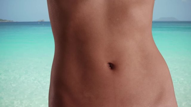 Isolated Closeup of Asian woman's flat belly