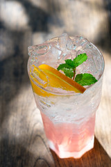 Pink lemonade, lemonade with taste of a rose. Cold sweet red ice with soda freshness soft drinks.