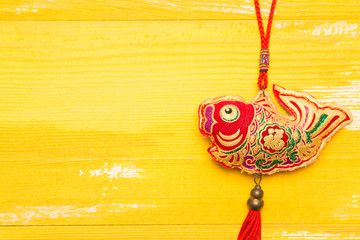 Chinese knot in yellow wood