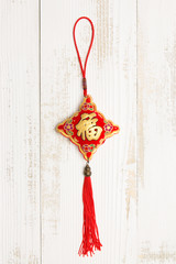 Chinese knot in white wood