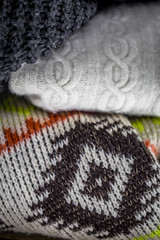 Sweaters on wooden background