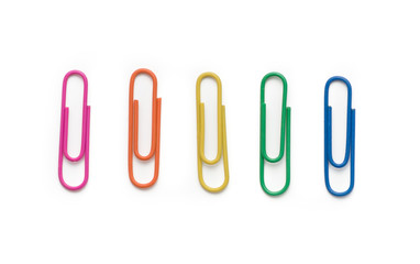Colored paper clips on a white background. Top view.
