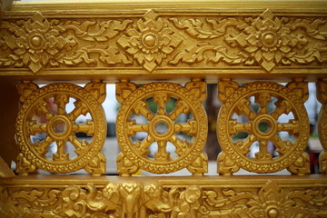 gold color wall of Wat Pak Nam Jolo in Chachoengsao at Thailand.