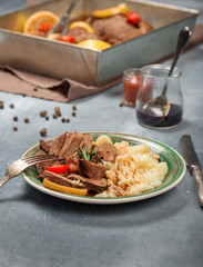 Beef stew with mashed potatoes on stone surface