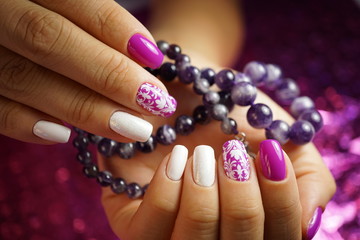 Beautiful bright natural nails with perfect clean manicure. Nail drill machine and cuticle nipper are used simultaneously to make such a clean manicure.