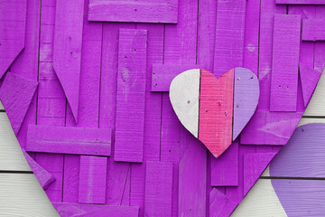 Heart shape on purple background made from recycle wood for valentine day