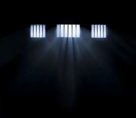 Light coming through a barred window with fog