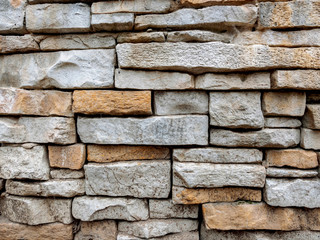 Texture of a stone laying from the gray and yellow stone put in any order.