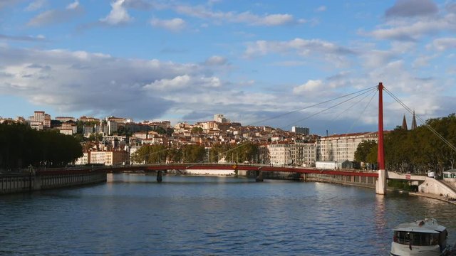 Timelipse view of Lyon city France Saone river, vaporeto and red bridge by day, 4k timelapse