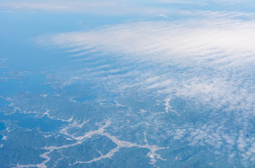 Misty aerial view of land and ocean