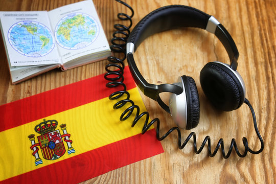 course language headphone and flag on a table